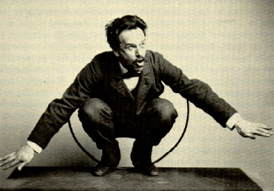  A photo of Boas crouched with arms spread to demonstrate a Kwakiutl dance. (www.osu.orst.edu)